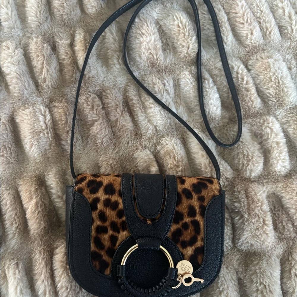 New without tags   
See By Chloe Leopard and Black Crossbody Bag…..